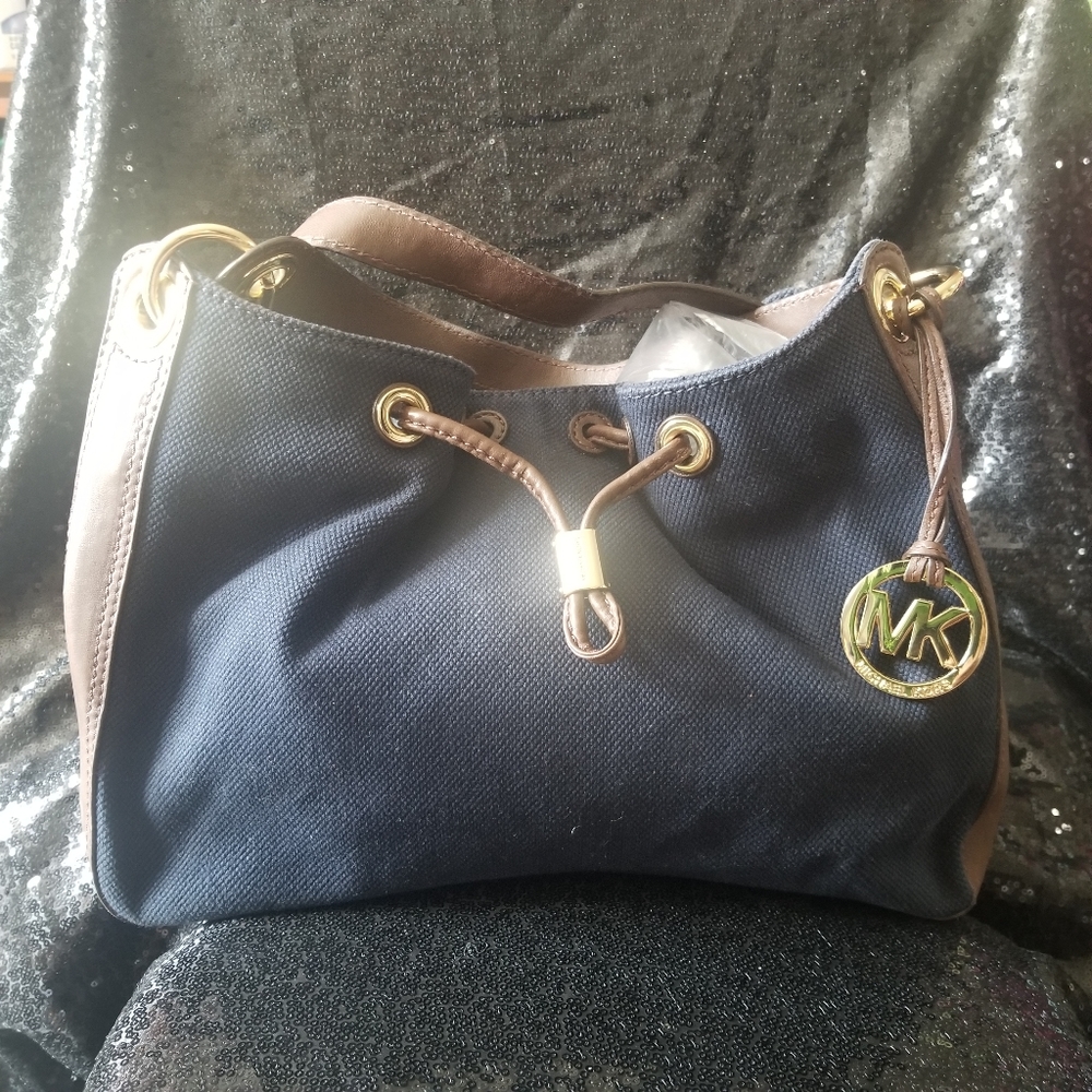 Michael Kors Navy canvas and brown leather trim handbag.